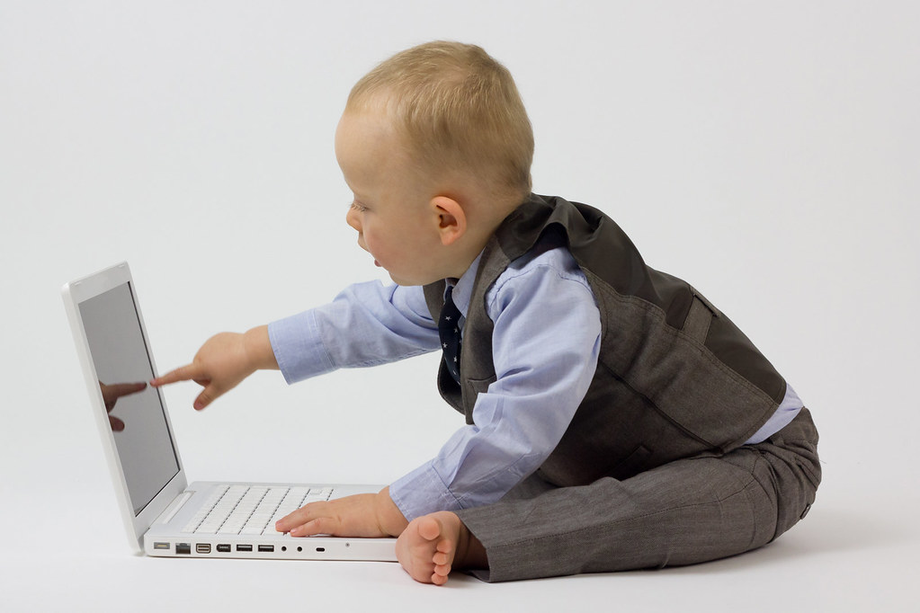 Marketer using AI tools on a laptop