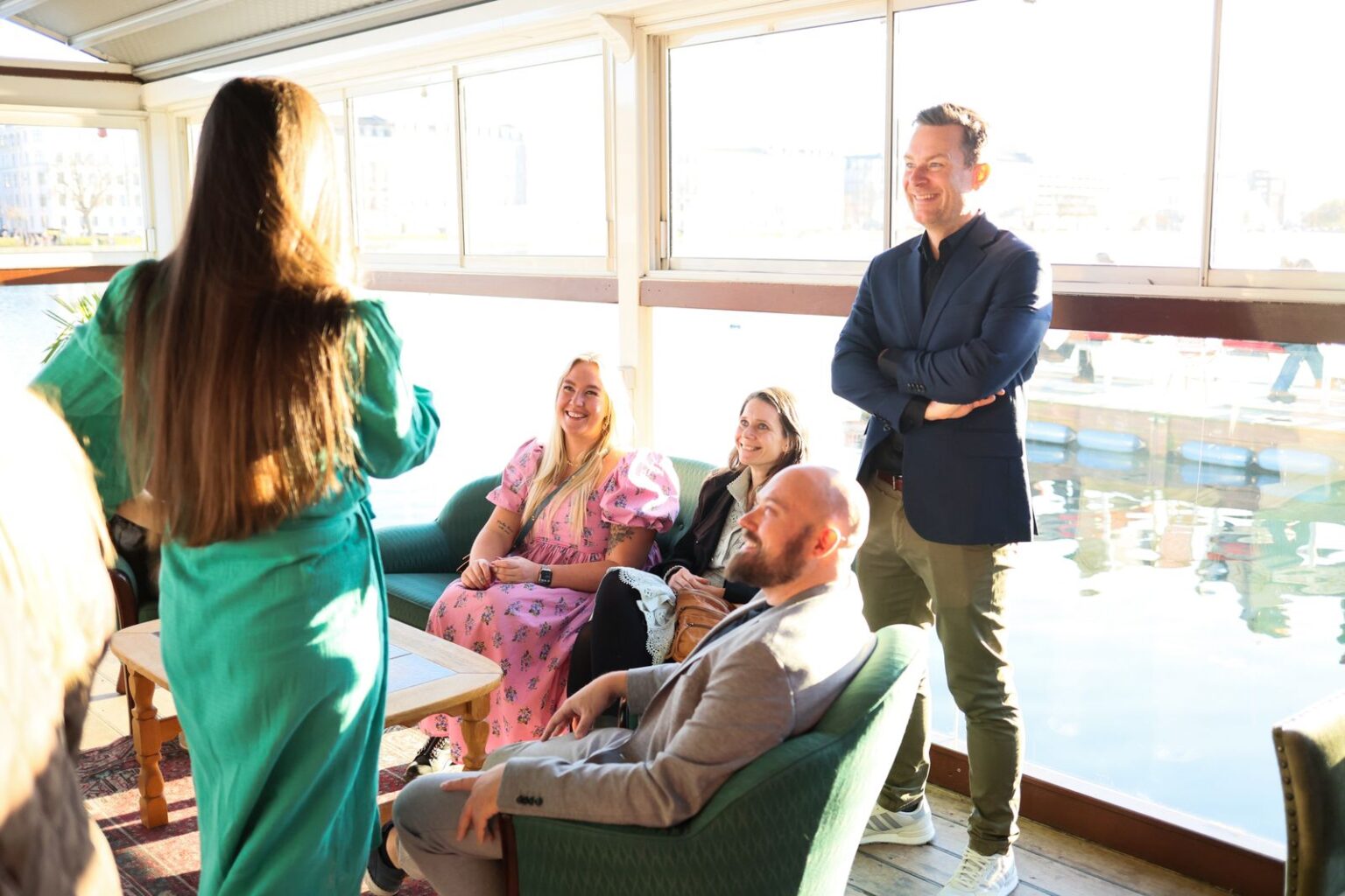 Professionals in conversation at a bright business event