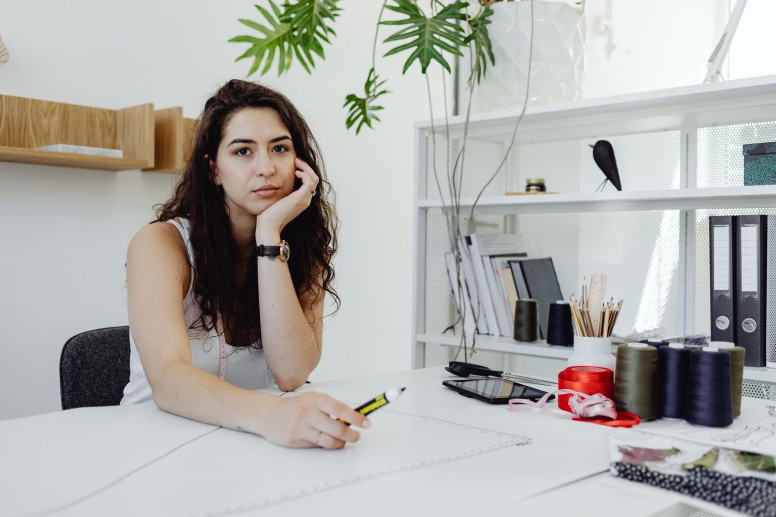 A creative professional at work in a bright studio